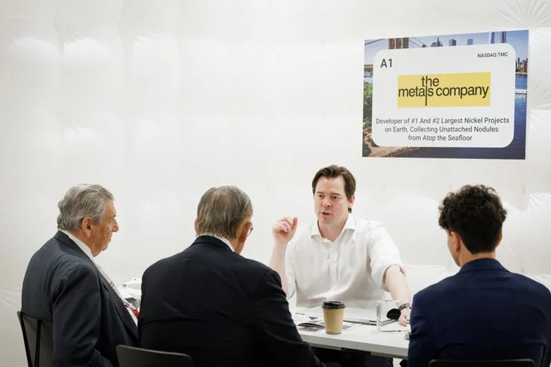 Mining company representatives discussing projects during a 1-2-1 meeting in New York