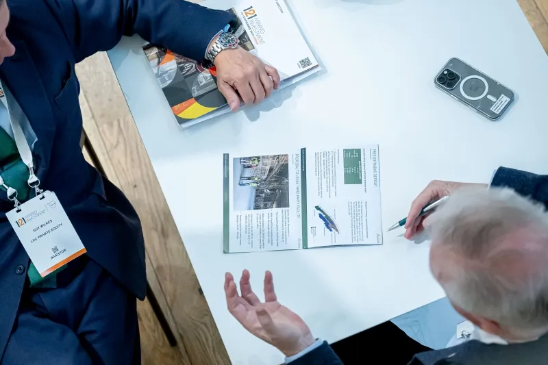 Mining industry professionals reviewing project information during a 1-2-1 meeting