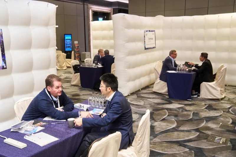Mining industry professionals discussing opportunities during a 1-2-1 meeting in Hong Kong