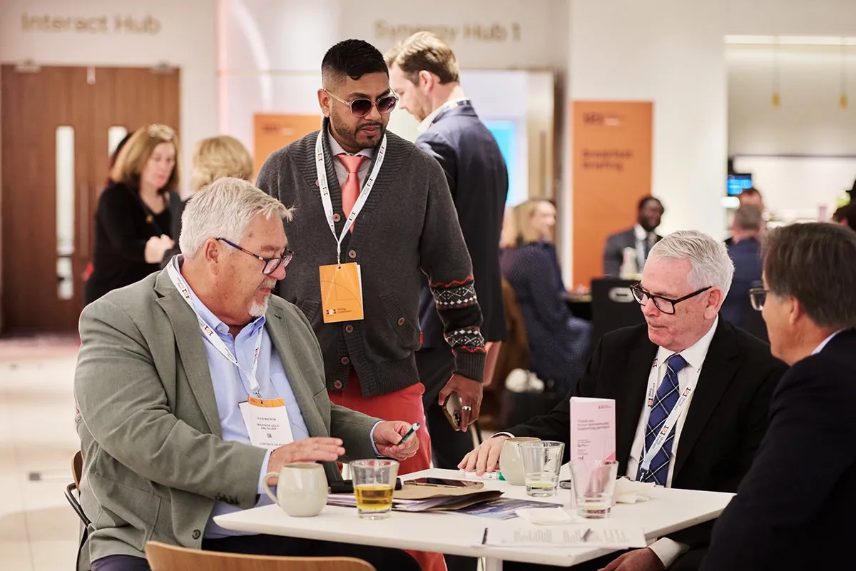 Mining industry professionals discussing opportunities at a 121 Mining Investment networking event