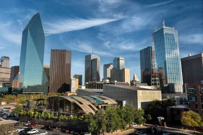 Dallas skyline with modern office towers under a blue sky