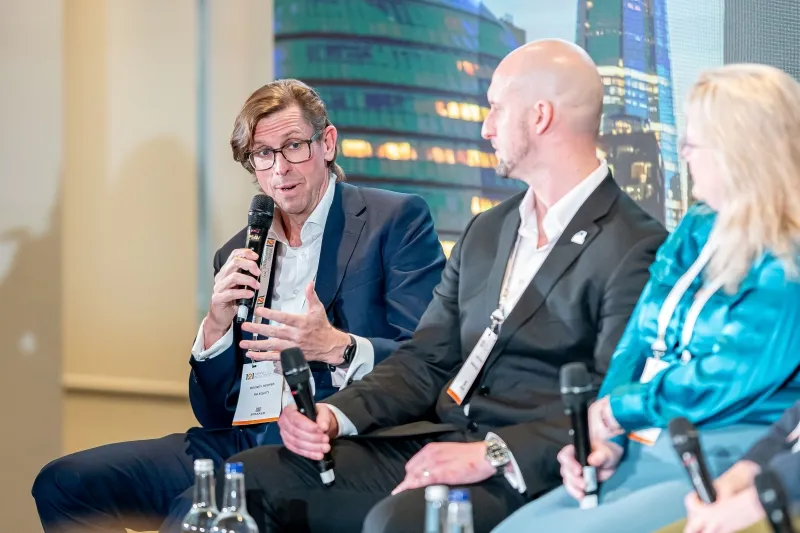 Mining industry expert speaking during a panel discussion at 121 Mining Investment