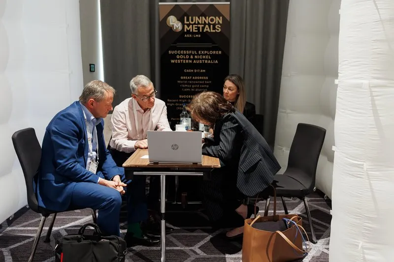 Mining industry professionals reviewing project information during a 1-2-1 meeting in London
